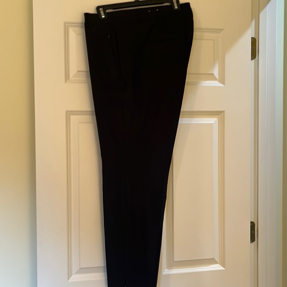 Black straight leg work pant with zippered pockets and notched ankle